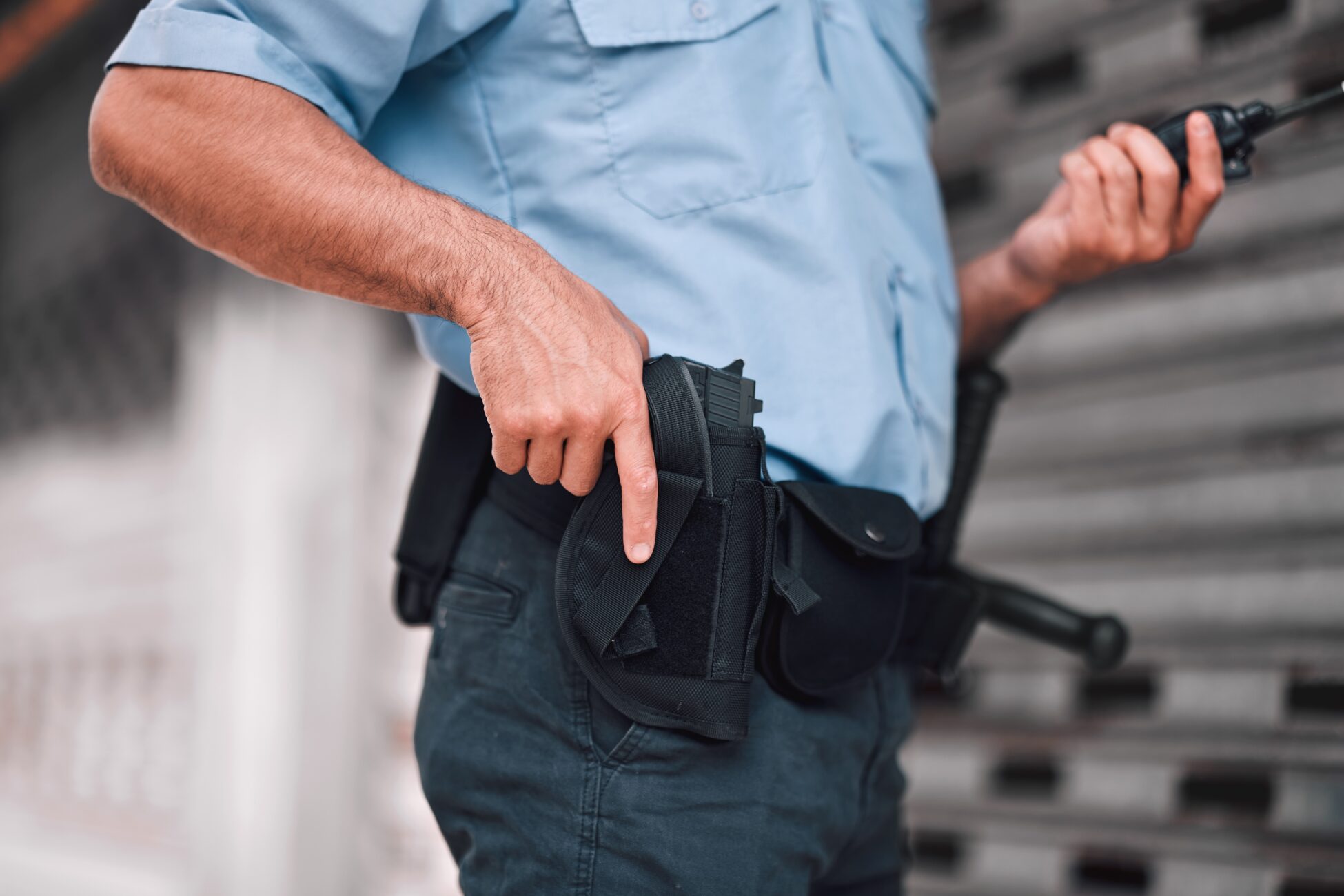 Closeup,,Law,Or,Police,Officer,With,A,Gun,,Safety,Or